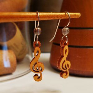 Musical treble clef dangles with bead accent